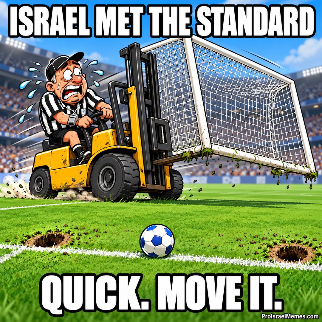 A sweating referee drives a yellow forklift carrying a white football goal across a pitch beside a blue-and-white ball.